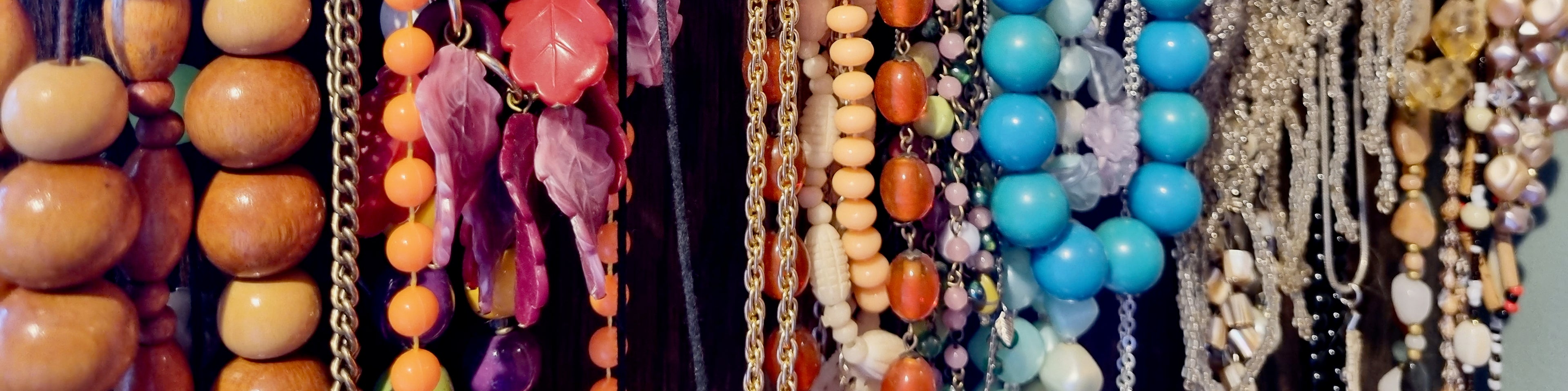 Banner image of a rack of various, eclectic jewellery sold by Nanna Bangles, New Zealand.