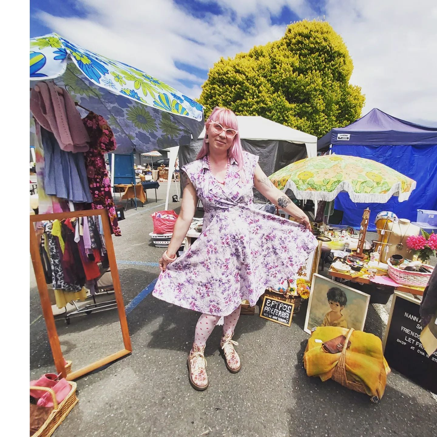 Nanna Bangles, aka Livvi, posing in a cute pink floral vintage dress with matching tights and shoes at the Motueka Sunday Market in Nelson, New Zealand.