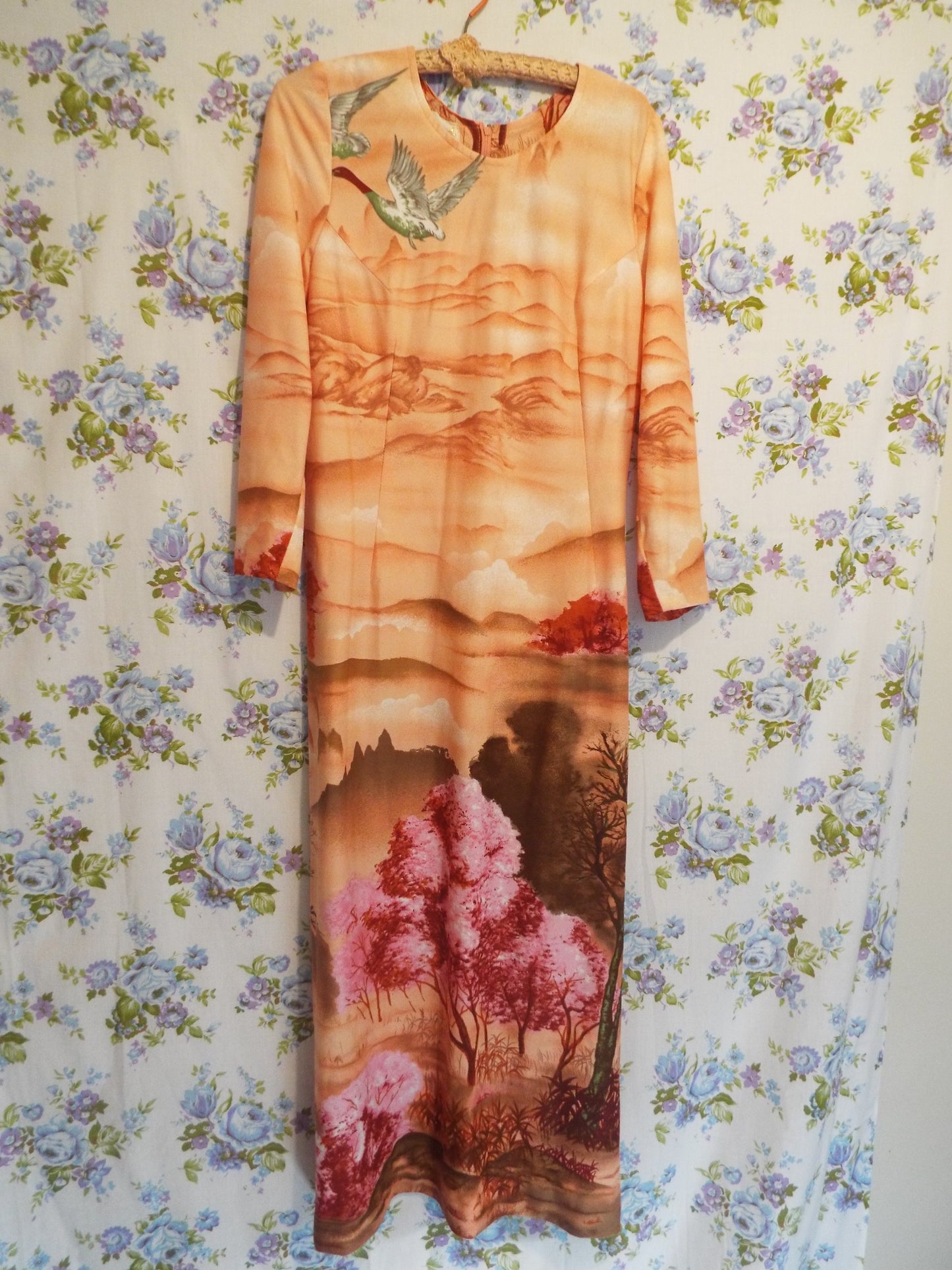 1970s Maxi Dress with Ducks (S-M) with a psychedelic woodland scene themed print, against patterned fabric with blue and purple roses.