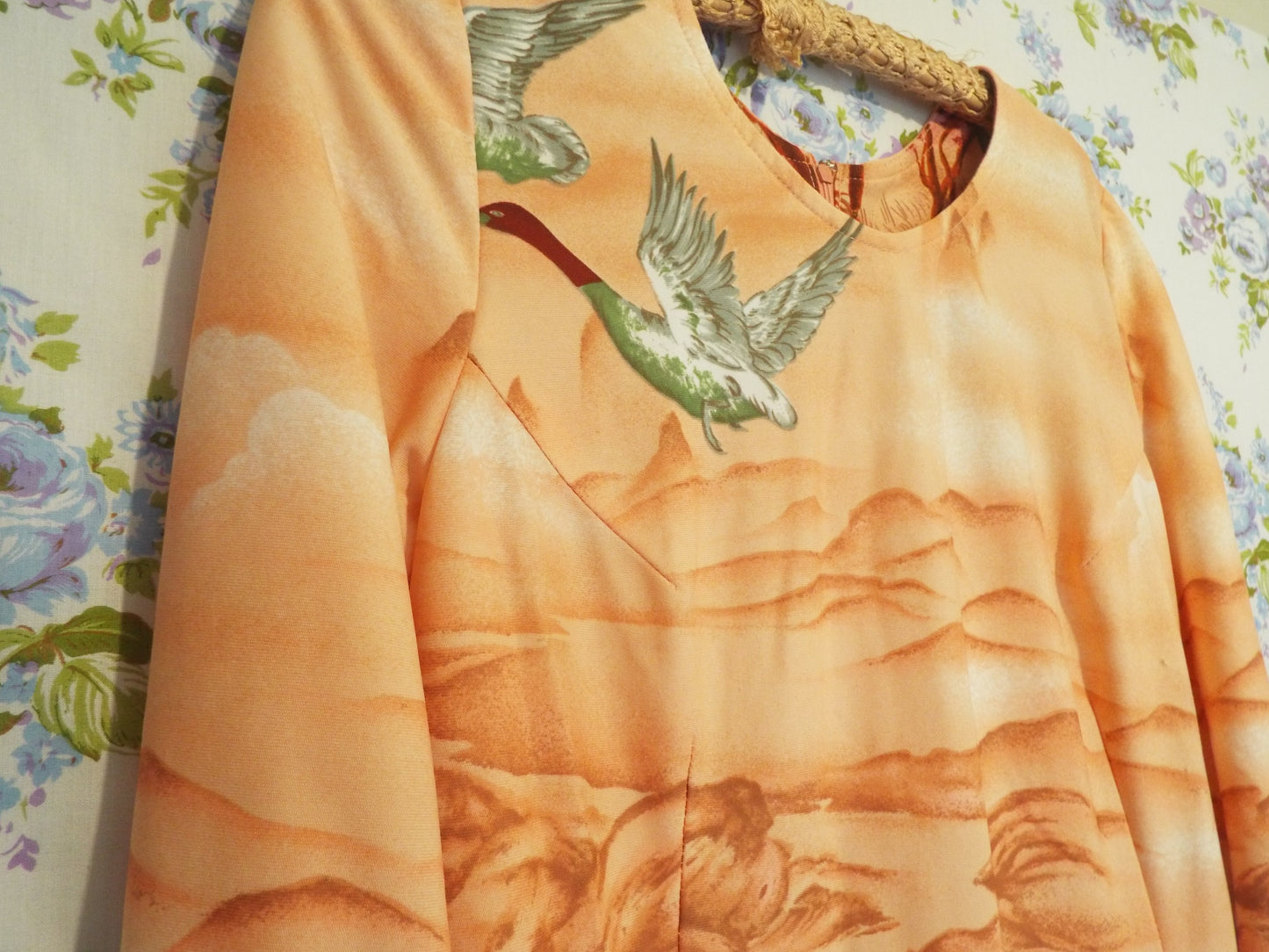 1970s Maxi Dress with Ducks (S-M) with a psychedelic woodland scene themed print, against patterned fabric with blue and purple roses.