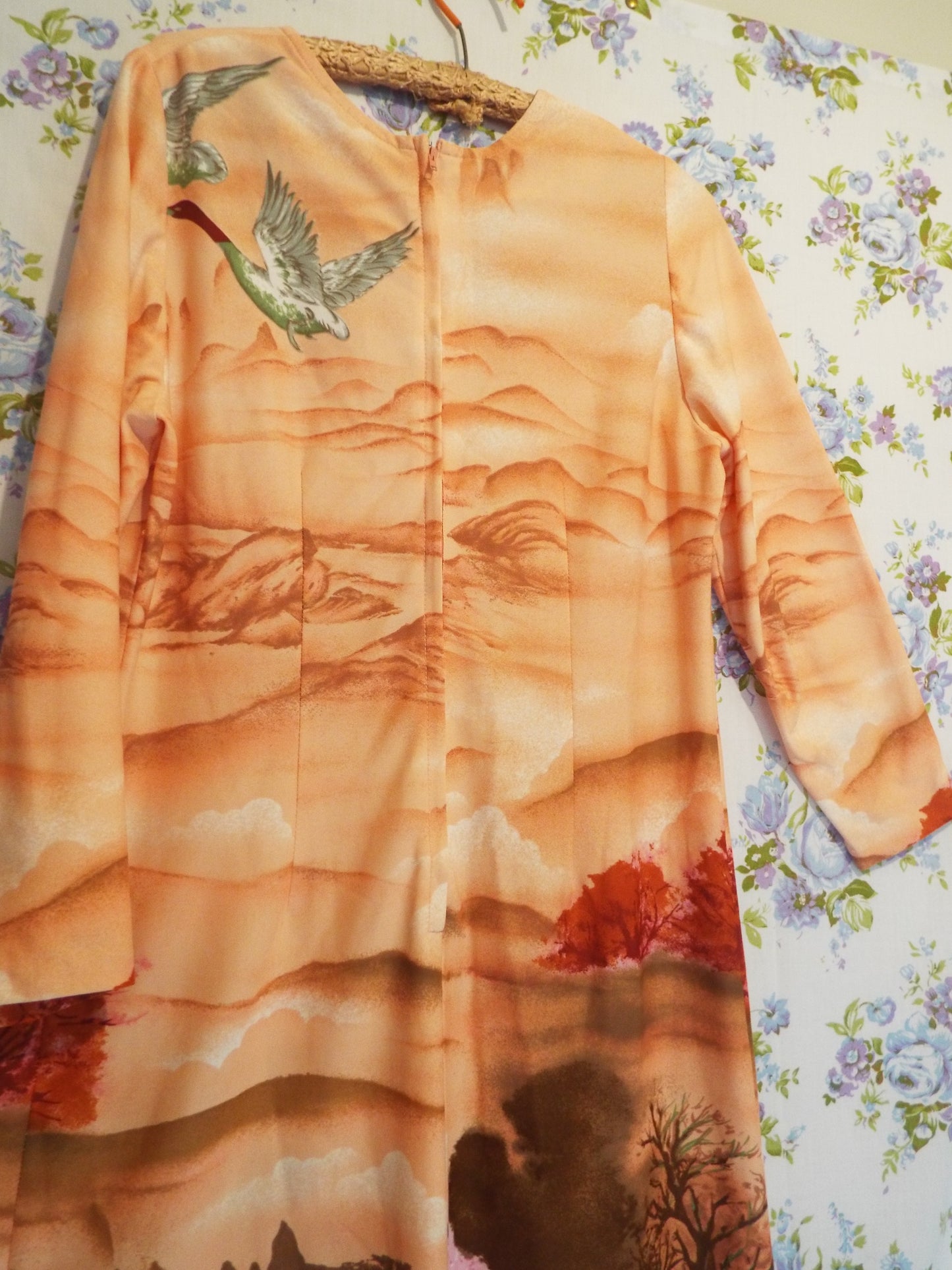 1970s Maxi Dress with Ducks (S-M) with a psychedelic woodland scene themed print, against patterned fabric with blue and purple roses.