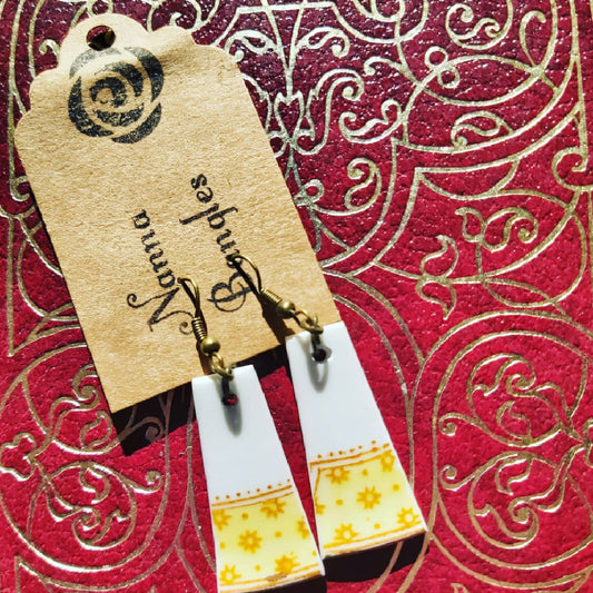 NEW Upcycled Ceramic Earrings - Yellow Band on Nanna Bangles-branded card against a red and gold-detailed backdrop.